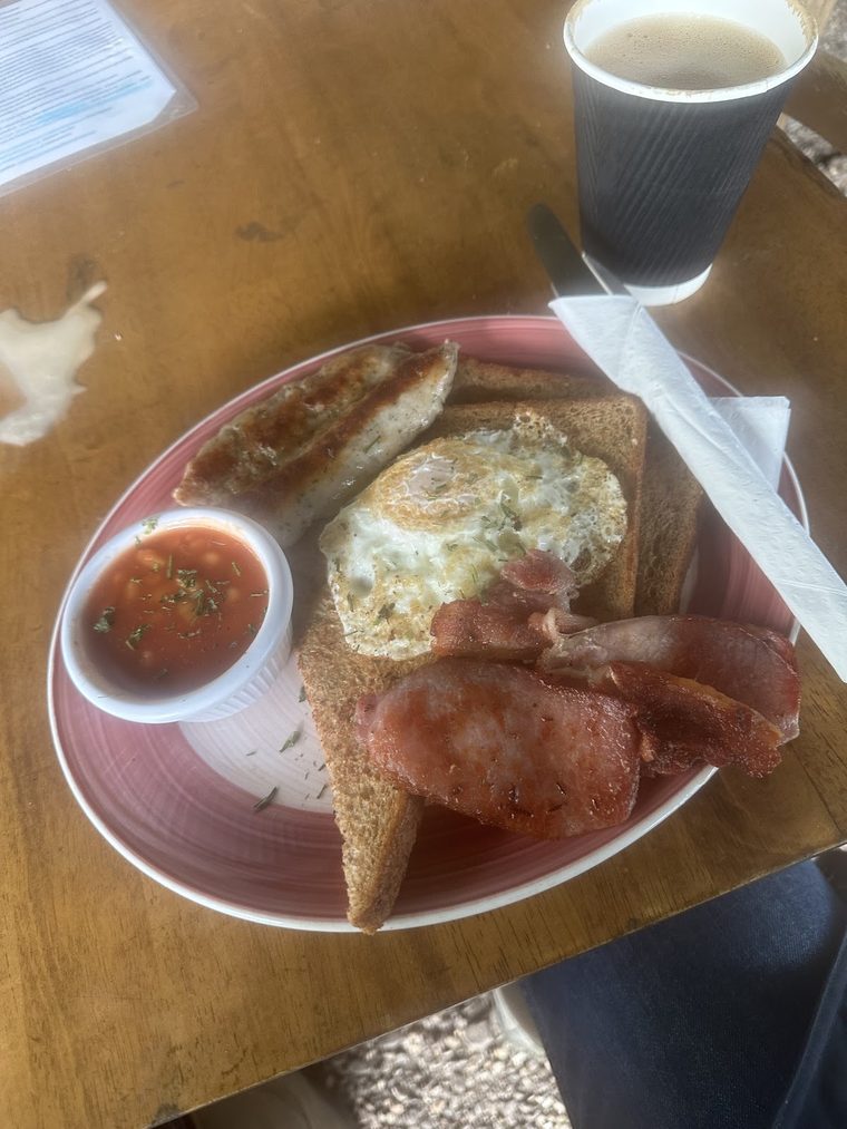 Full English breakfast with a takeaway coffee