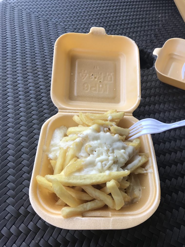 Cheesy chips in a takeaway box