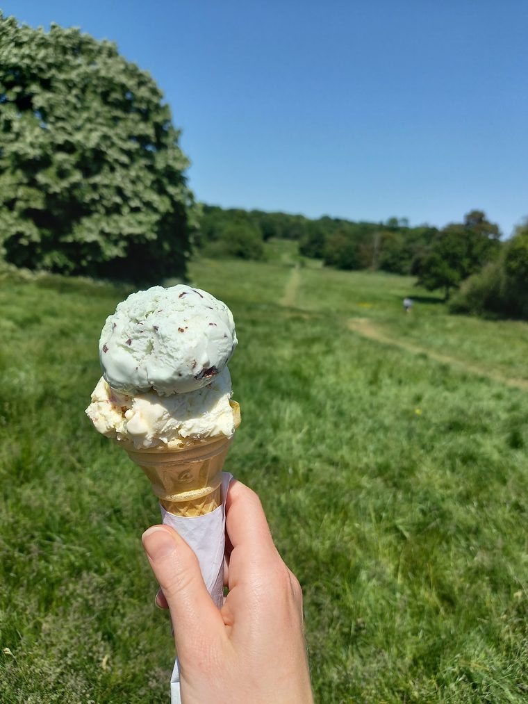 Two-scoop pistachio and vanilla ice cream cone